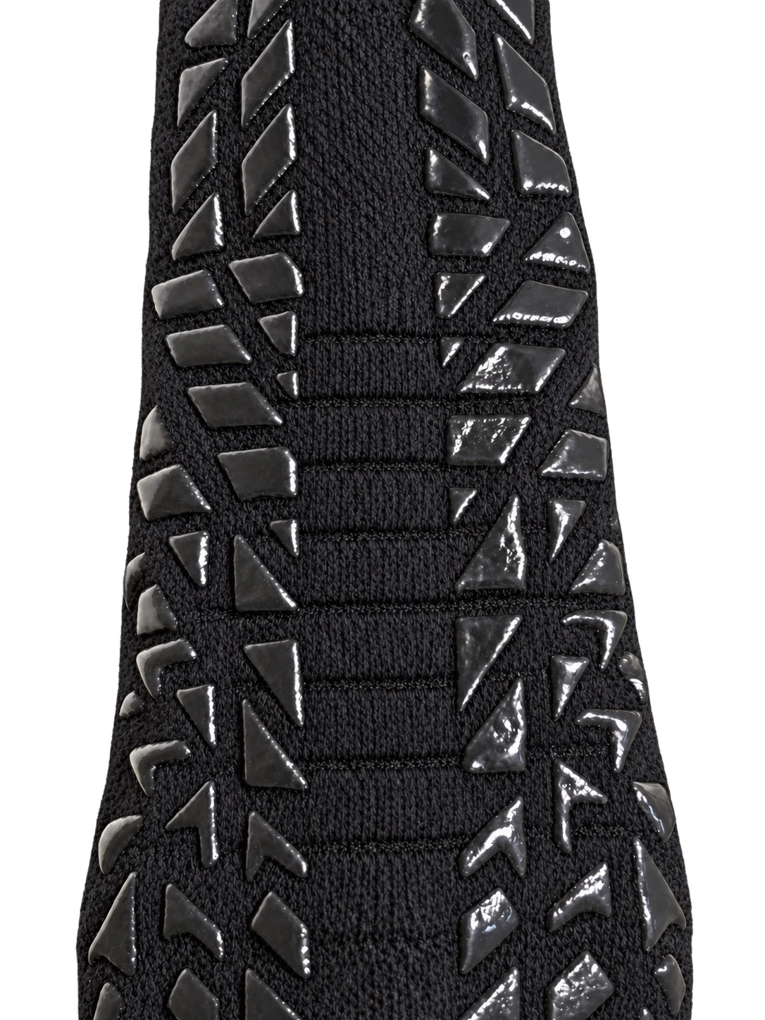 Actual product detail: glossy raised irregular geometric tread and textured black knit
